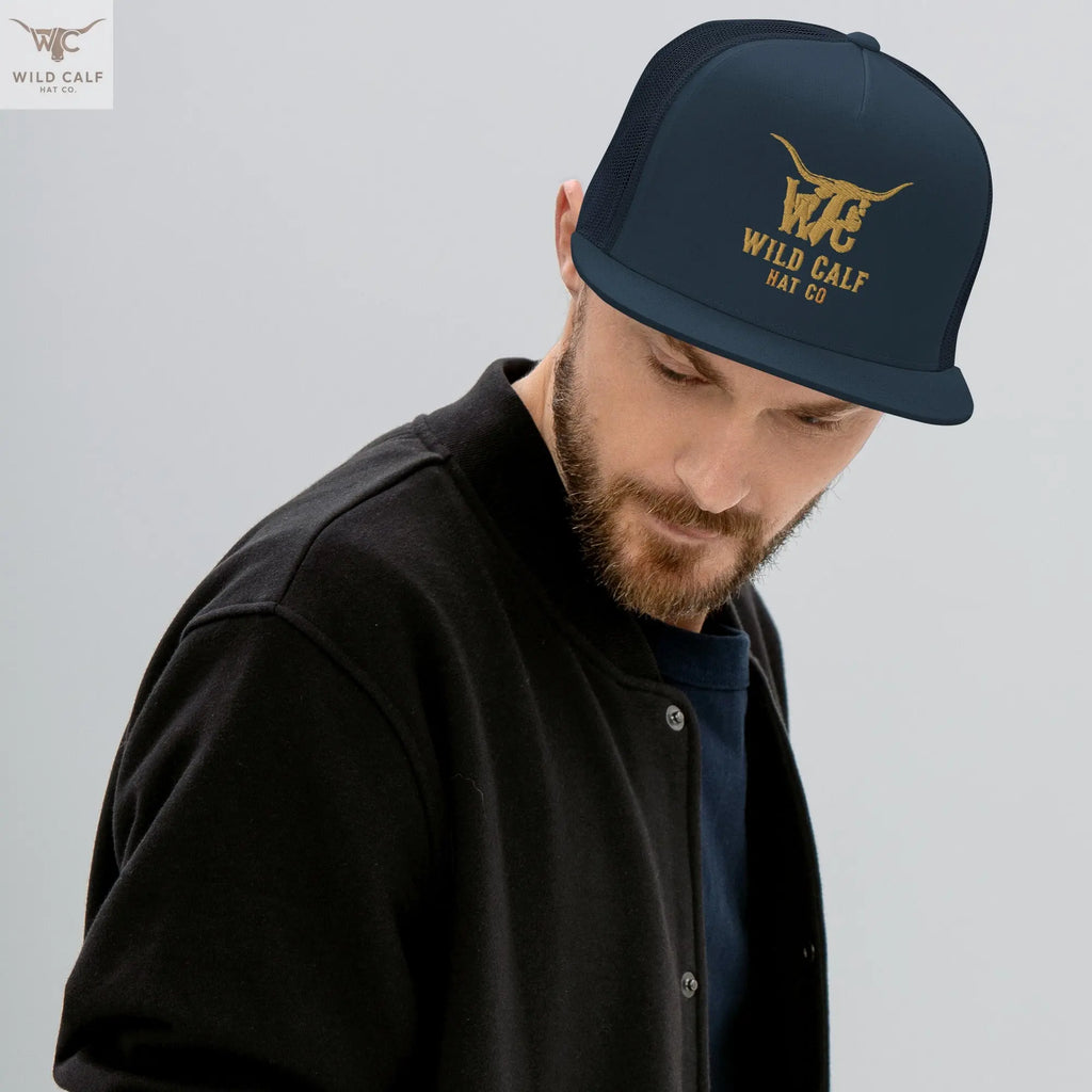 Man wearing navy western trucker cap with gold embroidery, professional casual style