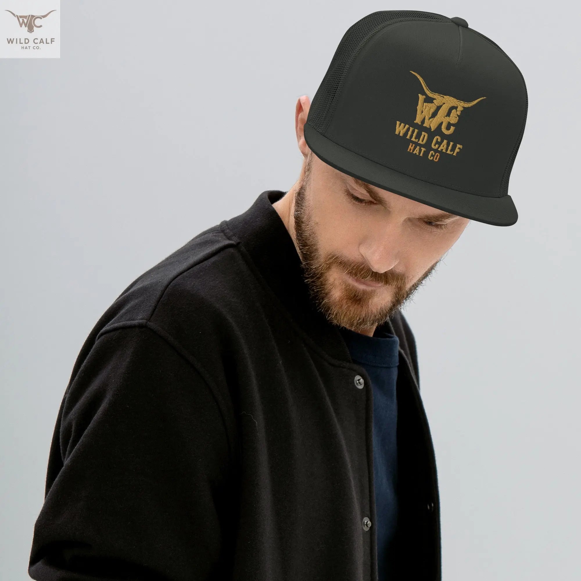 Man wearing charcoal 5-panel trucker cap with western embroidery, professional style