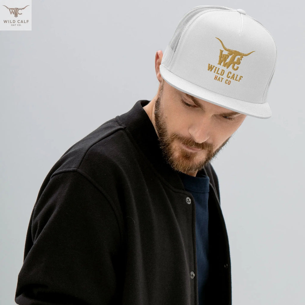 Man wearing a white western trucker cap with gold embroidery, professional style