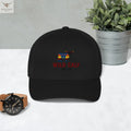 Black retro trucker hat with colorful western bull logo, styled on a marble surface.