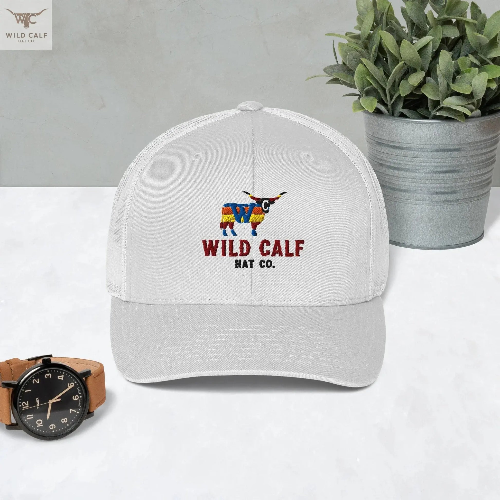 White retro trucker hat with colorful bull logo and 'Wild Calf Hat Co.' text, western style