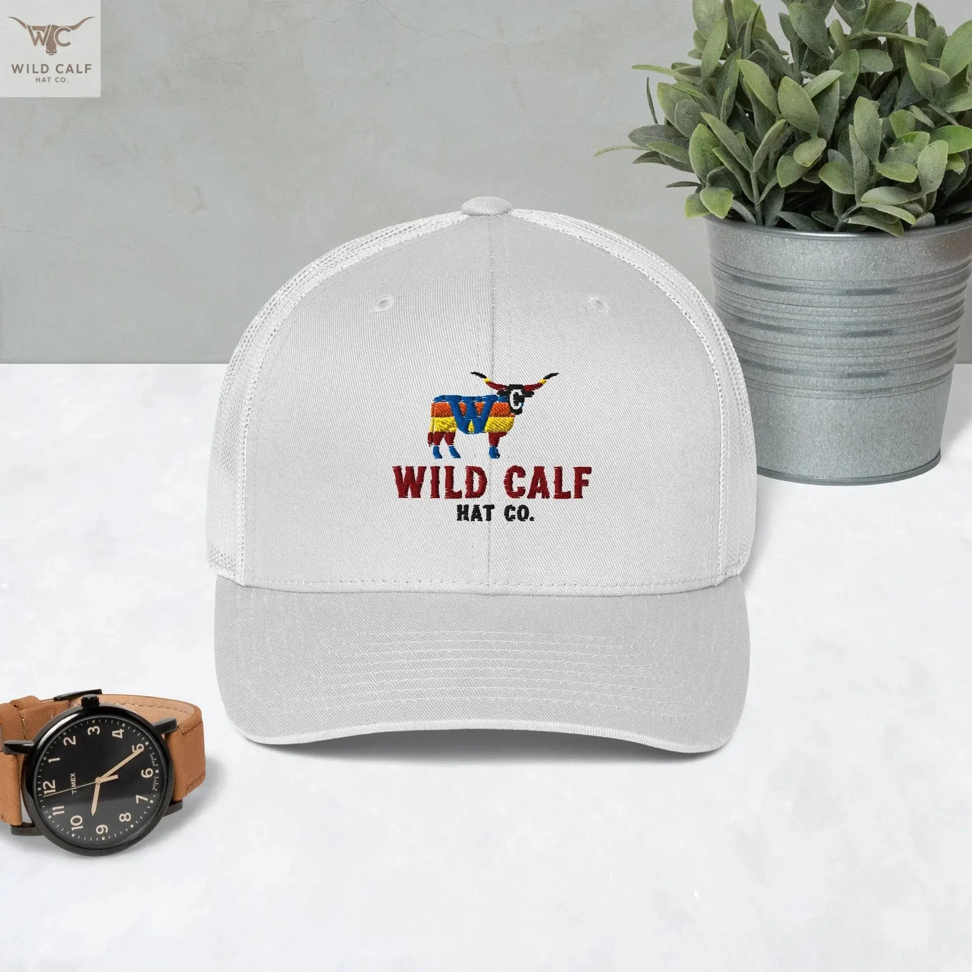 White retro trucker hat with colorful bull logo and 'Wild Calf Hat Co.' text, western style